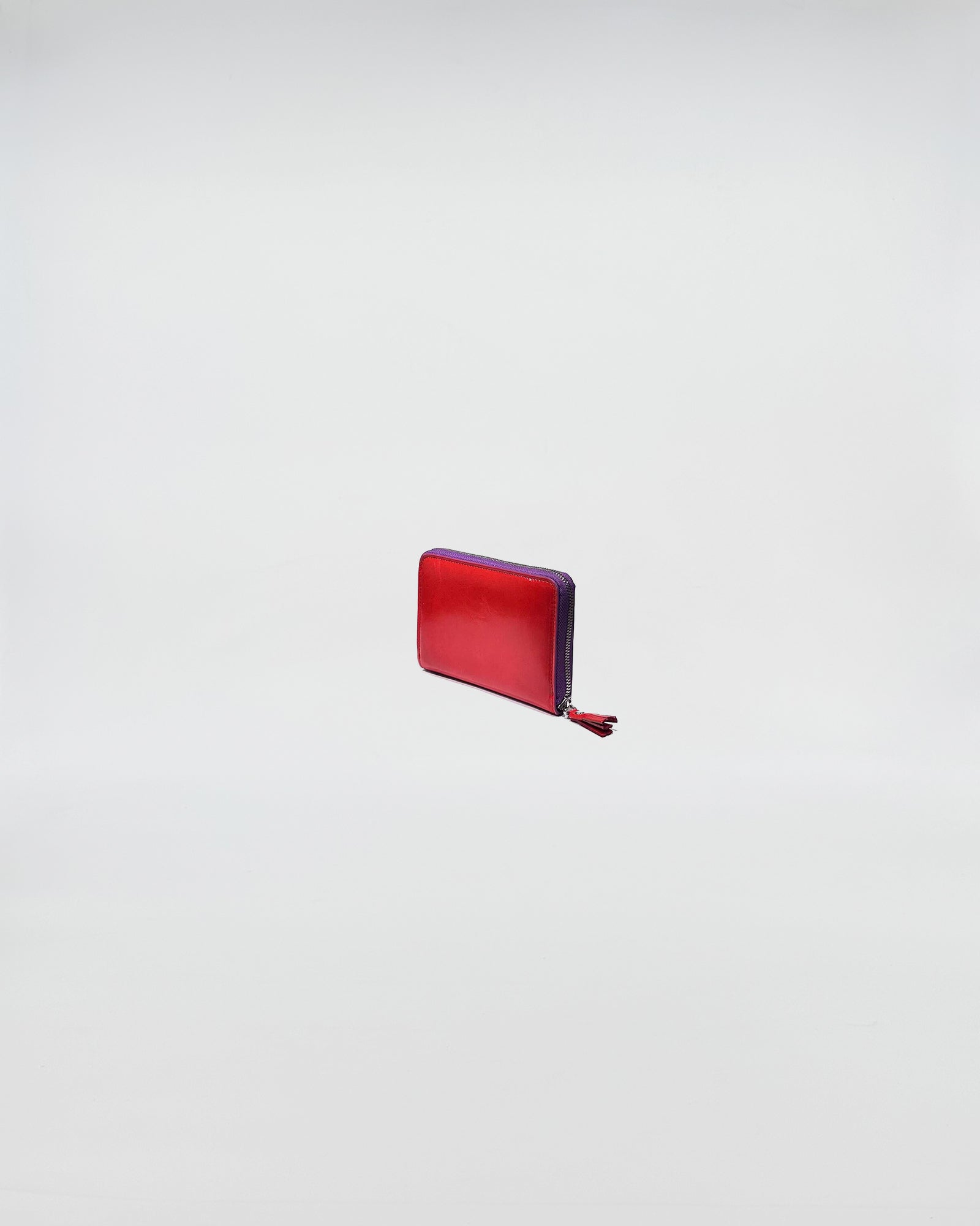 PORTAFOGLIO ZIP MINI in red and purple leather with zip closure, showcasing a stylish and sophisticated design.