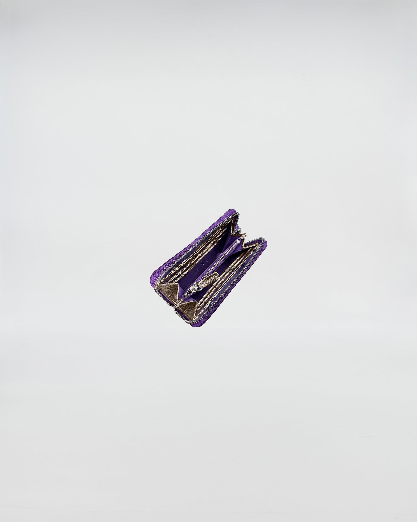 PORTAFOGLIO ZIP SMALL in purple with organized sections for cards and cash, showcasing a sophisticated design.