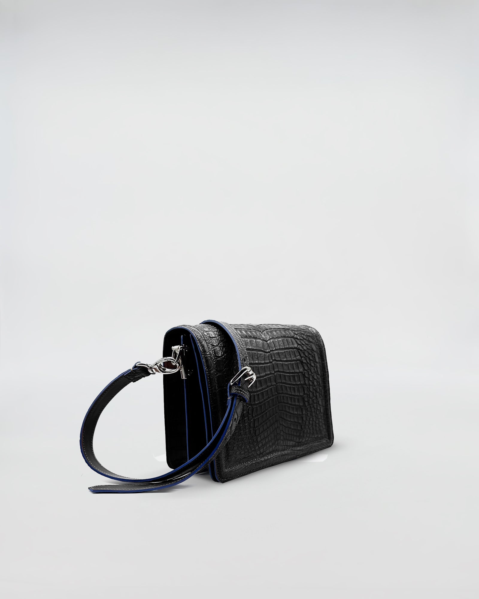 RANIA COCCO RECYCLE black recycled crocodile bag with removable strap and suede interior.