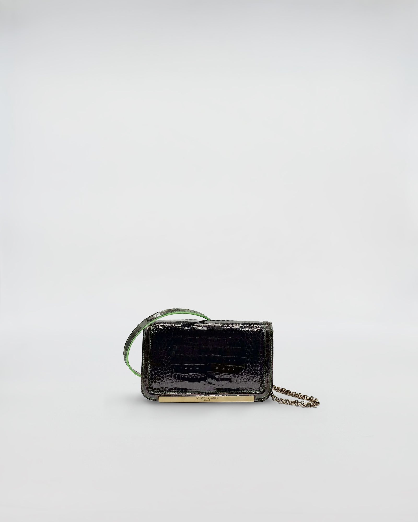 RANIA XMINI COCCO RECYCLE luxury handbag made from recycled crocodile leather with green suede interior.