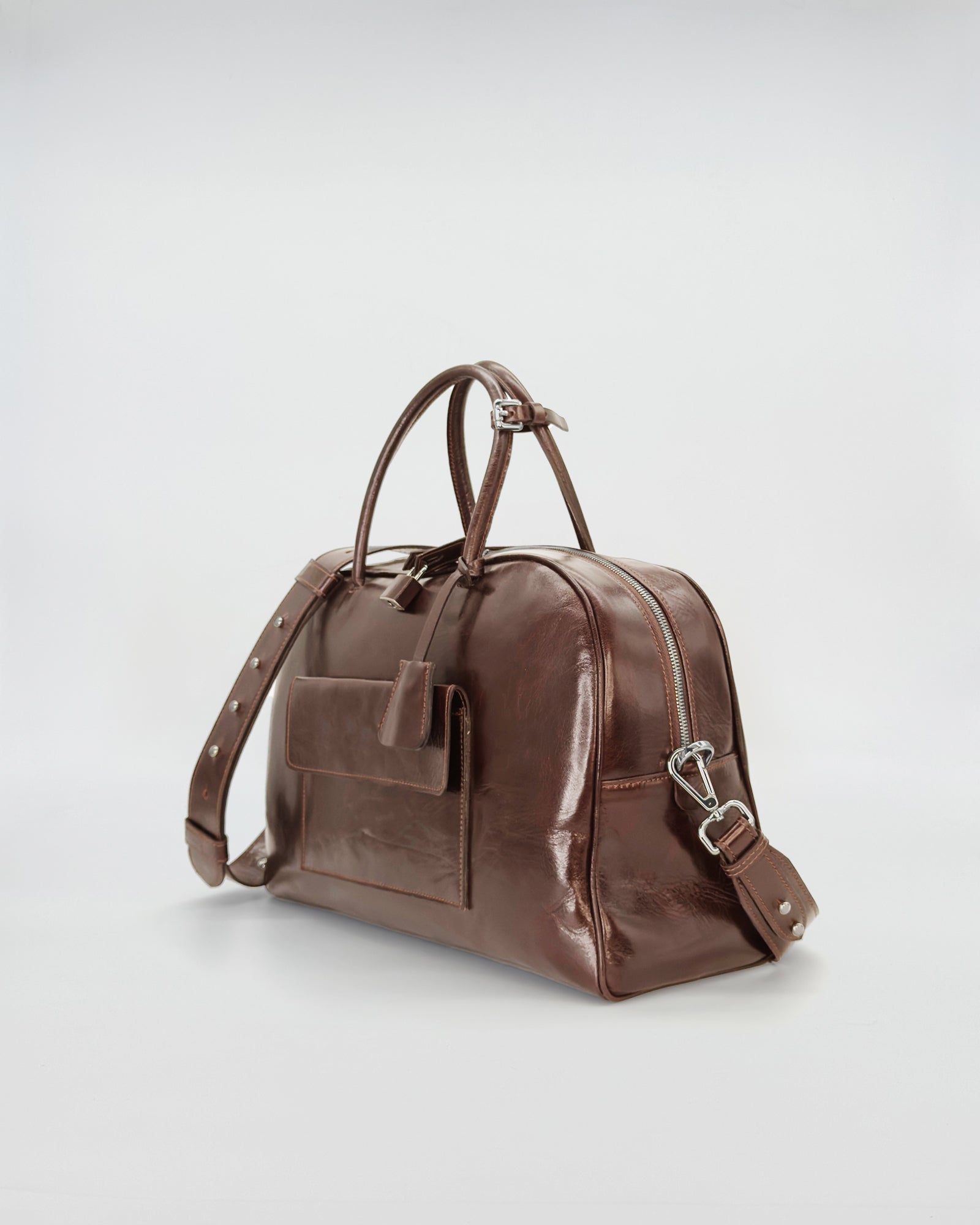 Zoe medium vitello semilucido brown leather bag with a chic design and spacious interior.