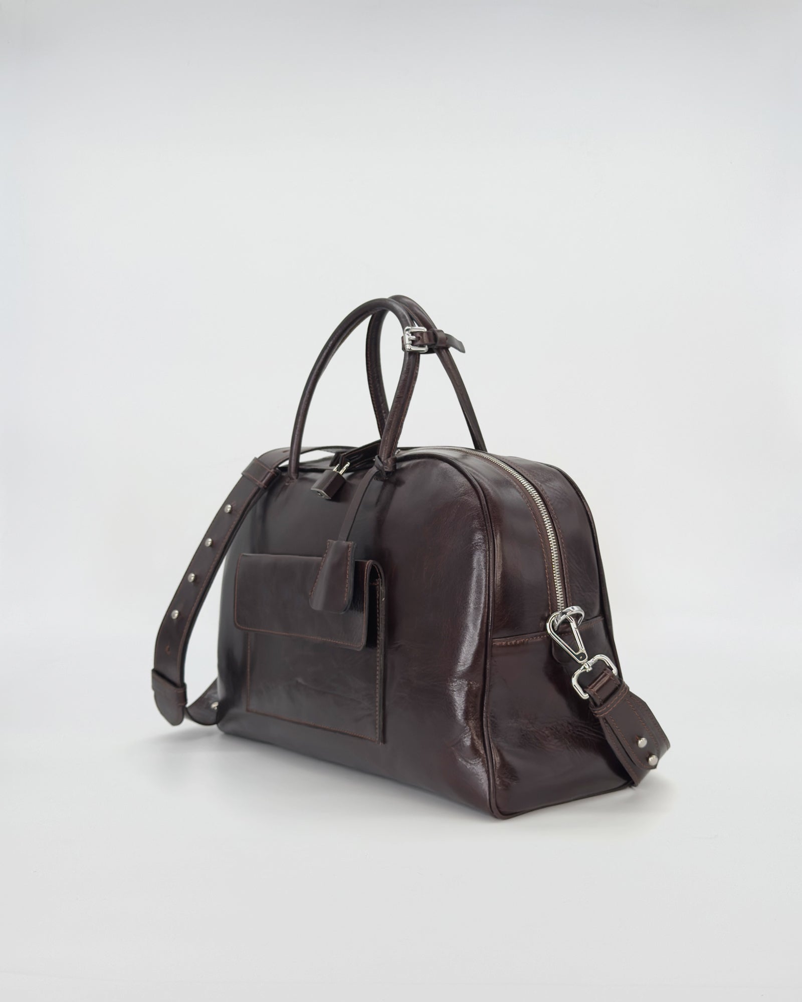 Zoe medium vitello semilucido handbag in dark brown, featuring elegant lines and a spacious design.