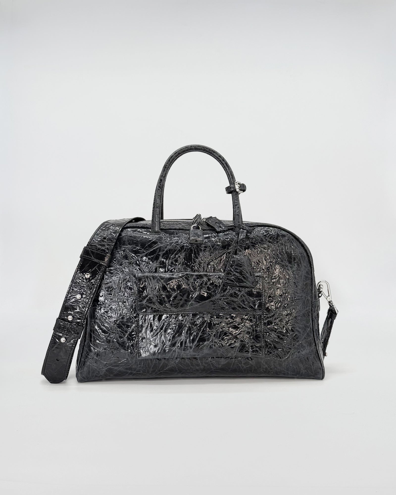 Zoe Medium Vitele Strizzato black handbag with a sleek design and modern features.