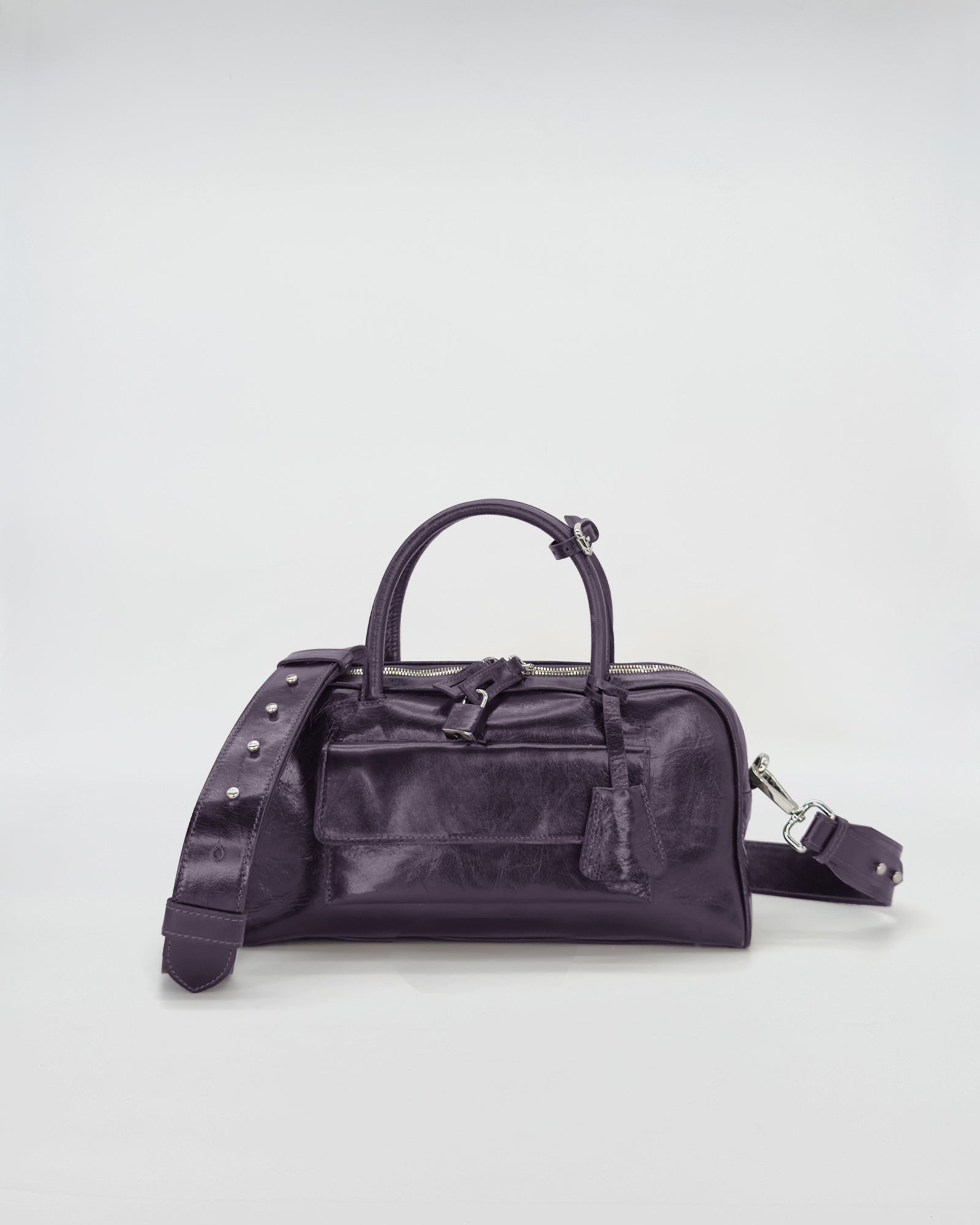 Zoe small vitello semilucido bag in elegant purple, showcasing a sleek design and versatile shoulder strap.
